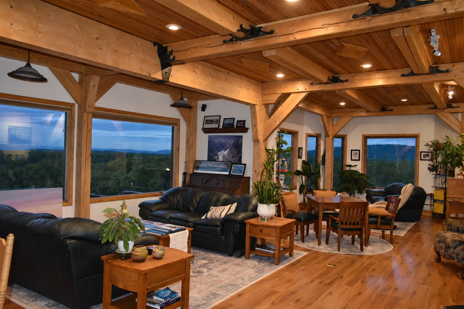 Shared lounge and dining area with large windows at Denali Overlook Inn